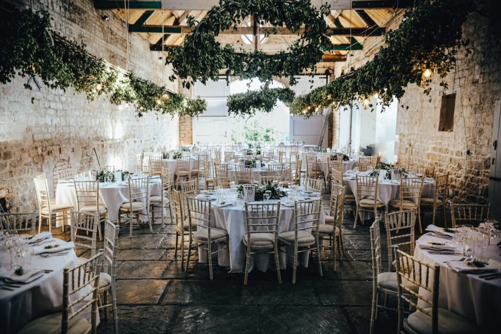 several tables arranged for a wedding meal